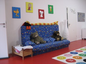 large blue sofa with stuffed animals
